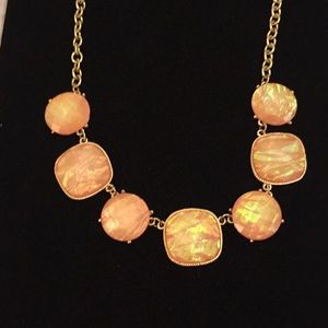 Pink iridescent necklace.